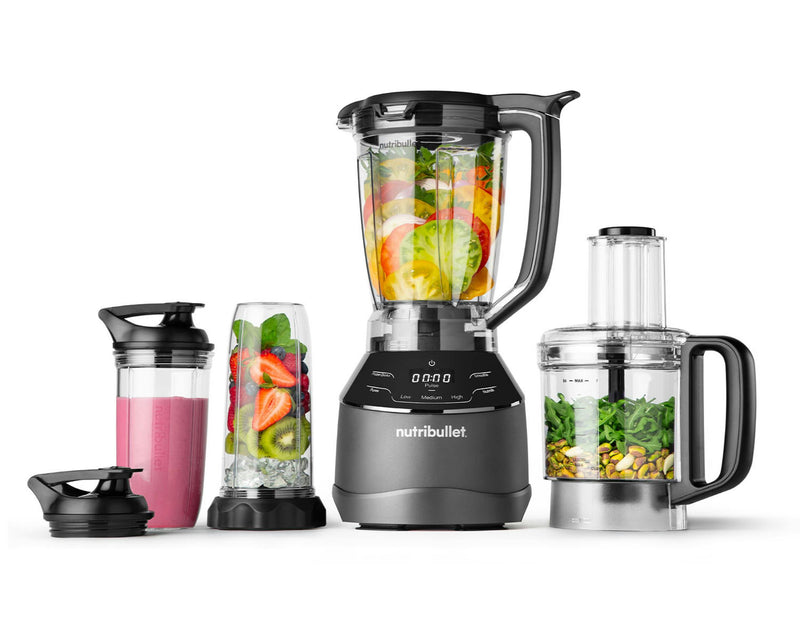 NutriBullet Triple Prep System filled with fruits, vegetables, nuts, ice and smoothie